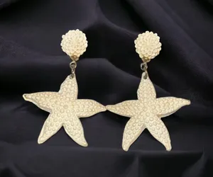 White resin starfish dangle post earrings thumbnail 1