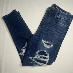 American Eagle Outfitters Super Hi-Rise Dark Wash Jegging (14) thumbnail 1