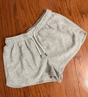 Colsie light gray terry fleece lounge shorts - Size XS. light gray terry fleece lounge shorts feature a comfortable elastic drawstring waistband, curved dolphin hem, and side pockets. Gently warn and in excellent condition. Measurements approximately 11” not fully stretched out from elastic waste x 10” long. Non smoking home. priced to sell at as is condition. Don’t like my price, make reasonable offer! And thank you for checking my closet. thumbnail 1