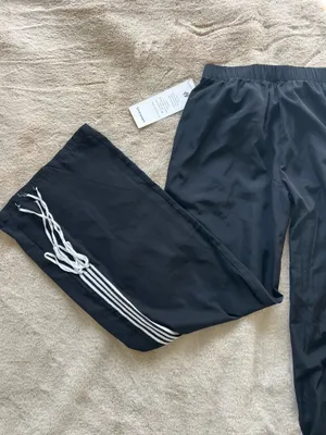 Windbreaker track sweatpants with bows Black thumbnail 8