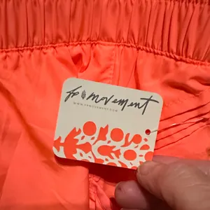 Free People Movement Get Your Flirt On Neon Coral Tennis or Pickleball Shorts thumbnail 4