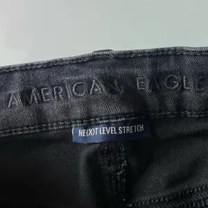 American Eagle • Distressed Washed Black Button Fly Super High Rise Shorties thumbnail 4
