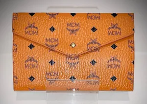 MCM Tangerine Logo Pattern Clutch thumbnail 1