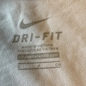 Nike Women's White and Blue University of Washington Tee thumbnail 7