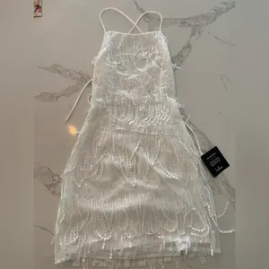 Lulu’s Making Magic White Fringe Lace-Up Mini Homecoming Dress thumbnail 2