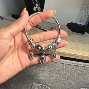 Silver bracelet with evil eye charms. thumbnail 1
