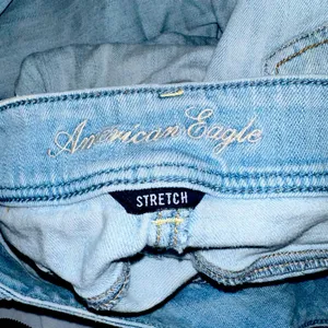 American Eagle • Destroyed Light Wash Skinny Jeans • Size 8 thumbnail 2