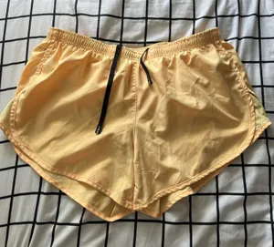 Size medium butter yellow nike running shorts thumbnail 1
