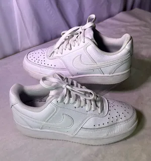 Nike White Mesh Low-Top Sneakers with Black Logo thumbnail 1