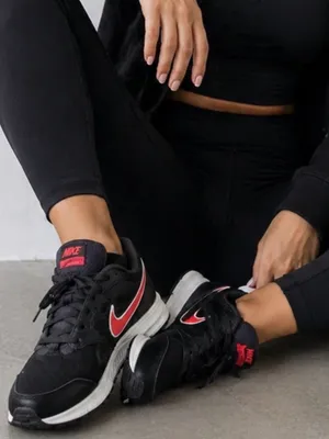 Nike Women's Black Sneakers with Red Swoosh thumbnail 1