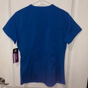 blue Dickies Balance scrub top features a v-neckline and a functional chest pocket. thumbnail 3