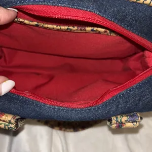 Blue Denim Handbag With Floral Corklike Design On Bottom & Handles Red Interior thumbnail 8