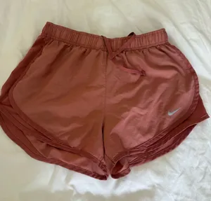 Nike Women’s Dusty Rose Athletic Shorts with Reflective Swoosh thumbnail 1
