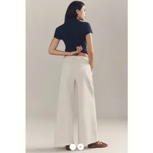 By Anthropologie Low-Rise Pleated Wide-Leg Trousers thumbnail 4