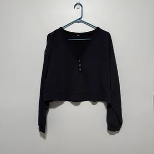 Alo Yoga Micro Waffle Pleasant Cropped Henley in Black thumbnail 2