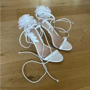 Gianni Bini x Caelynn Bell - Papillon Flower Ankle Wrap Strappy Sandals in White thumbnail 1