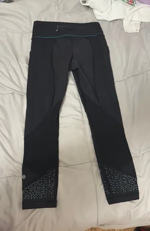 Lululemon Capri Black Leggings w/ teal details thumbnail 1