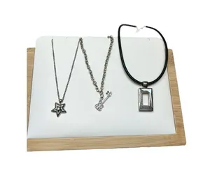 Three silver toned necklace set - guitar pendant, dog paw and square pendant s thumbnail 1