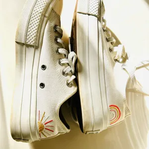 Ivory Converse sneakers with vibrant sun & rainbow side embroidery. thumbnail 6