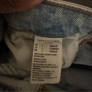 American eagle AE stretch mom jeans light wash blue ripped distressed size 4R thumbnail 9