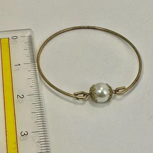 Gold tone faux pearl bangle bracelet thumbnail 2