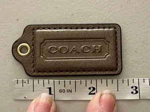 Coach Bronze Color Hang Tag thumbnail 1