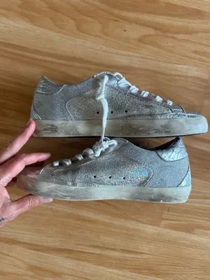 GOLDEN GOOSE Super-Star Iridescent and Glitter Leather Sneakers - Sz 38 - US 7 1/2 These are in good condition with light wear throughout. They are a pretty hard to find but super cute style. They have like holographic leather and glitter areas. Please see pics for details. Metallic leather upper Round toe Lace-up closure White leather star Cushioned insole; unlined Rubber sole Made in Italy thumbnail 9