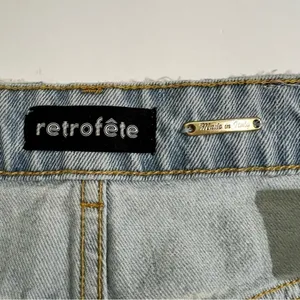 Retrofête Maeve Distressed Denim Mini Skirt Asymmetric Light Wash L thumbnail 6