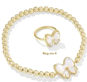 Kendra Scott Haley Bow Stretch Bracelet and matching ring set in gold thumbnail 1