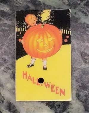 Vintage Halloween girl holding pumpkin pin thumbnail 1