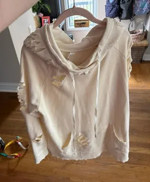 Alo Yoga ivory ripped hoodie‎ sweatshirt featuring distressed detailing large thumbnail 1