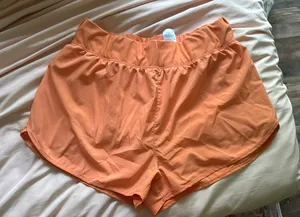 ASICS Women’s Athletic Shorts running orange medium thumbnail 1