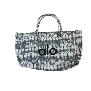 Alo Yoga Iconic Shopper Tote in a gray tie-dye cotton canvas material thumbnail 3