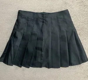Black Plain Pleated Skirt With Mini Skirt Lining Shorts thumbnail 1