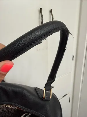 black woven duffle bag with gold hardware, some wear in the handles, no brand. thumbnail 6