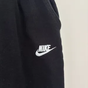 Black Nike sweatpants with drawstring waist and adjustable cuffs thumbnail 3