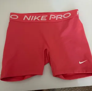 Nike Pro pink compression shorts in great pre-owned condition. Soft, stretchy, and perfect for workouts, running, the gym, or everyday athleisure wear. No major flaws. thumbnail 1