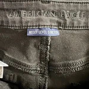 American Eagle Next Level Stretch Distressed High Rise Jegging 10 Regular Black thumbnail 3