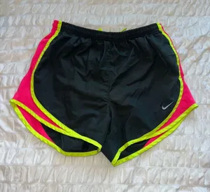 Nike Women’s Dark Grey Athletic Shorts with Neon Pink Panels thumbnail 1