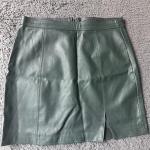 Dark green faux leather zip up skirt, size M thumbnail 1