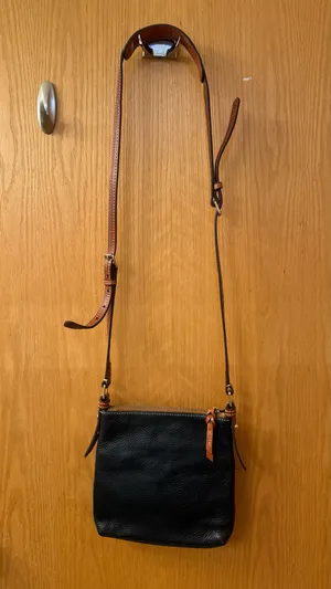 This is a Dooney & Bourke black pebbled leather crossbody thumbnail 3