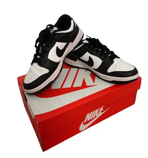 Nike Women’s Black and White Low-Top Sneakers thumbnail 1