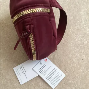 Lululemon Athletica Red and Gold Mini Bag Backpack Charm Nano Velour thumbnail 3