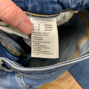 American Eagle Super Hi-Rise Flare Jeans Blue Distressed Raw Hem Women 10‎ Reg thumbnail 8