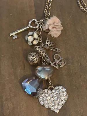 Gold tone love theme charm tassel necklace thumbnail 2
