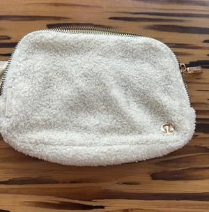 White fuzzy Lululemon belt bag thumbnail 1