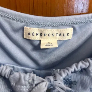NWT Aeropostale Blue Floral Butterfly Tie Neck Asymmetrical Bodycon Dress thumbnail 5