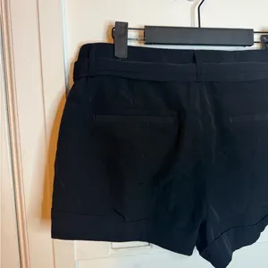 Express Y2K Black Sheen Belted Low Rise Belted Shorts thumbnail 6