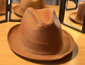 This Men’s Top Hat in size Medium is a stylish and lightweight accessory perfect for casual occasions during the winter, fall, and spring seasons. Made of wool felt in a solid brown color, this handmade top hat exudes a classic and sophisticated look. With its unique style and comfortable fit, this top hat is sure to add a touch of elegance to any ensemble. thumbnail 1