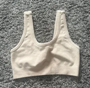 ALO Yoga Light Cream Ribbed Scoop Sports Tank thumbnail 1